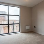 Empty room with large window view.