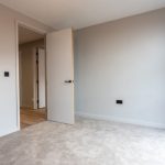 Empty room with open door.