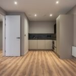 Modern kitchen in minimalist apartment design.