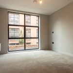 Empty room with large window view.