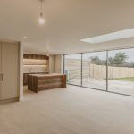 Modern kitchen with large glass doors