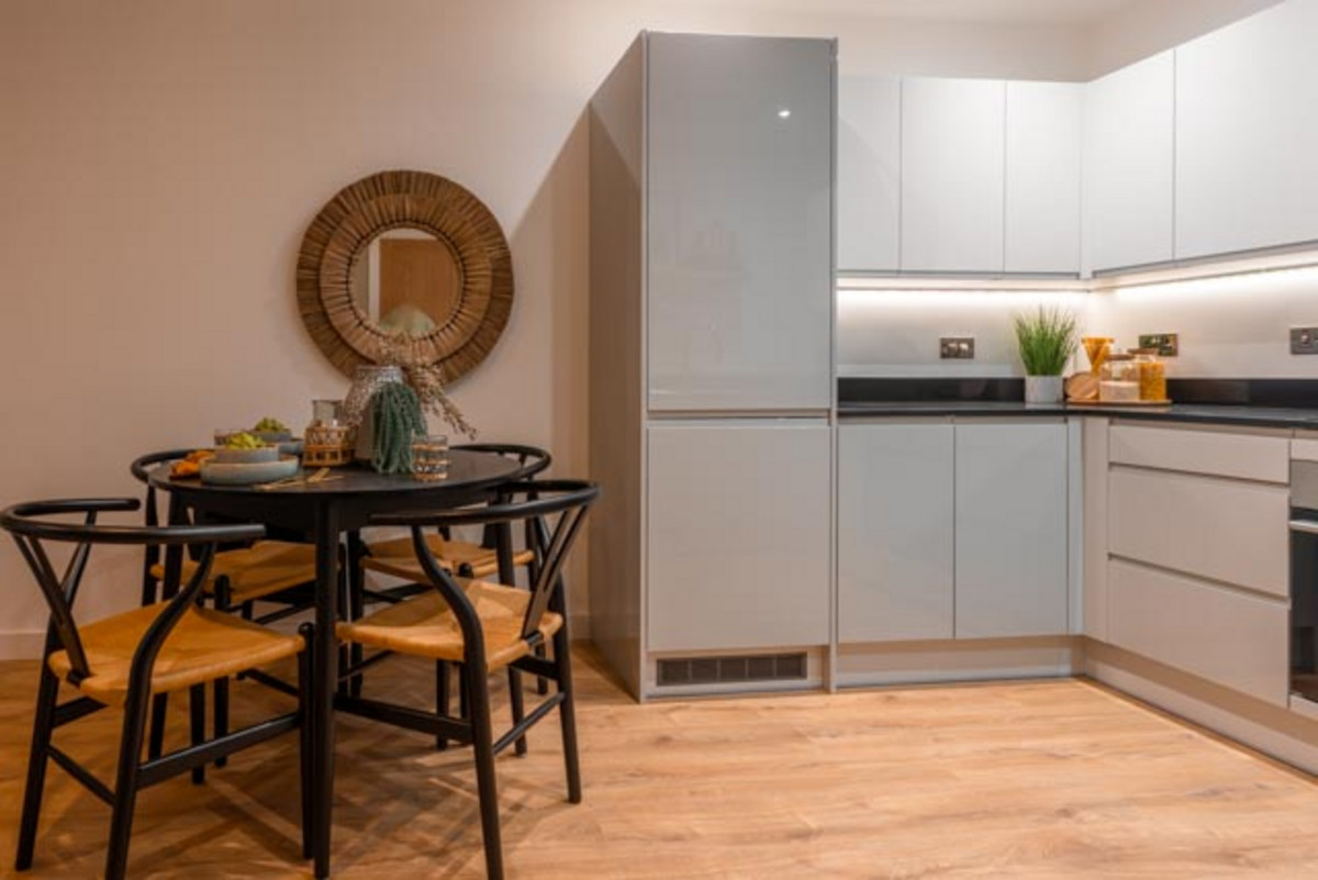 Modern kitchen with dining area.