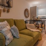 Modern living space with green sofa