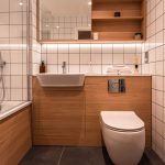 Modern bathroom with wooden accents.