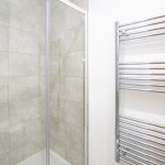 Modern shower with heated towel rail.
