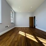 Spacious room with wooden flooring.