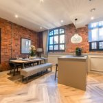 Stylish kitchen with exposed brick walls.