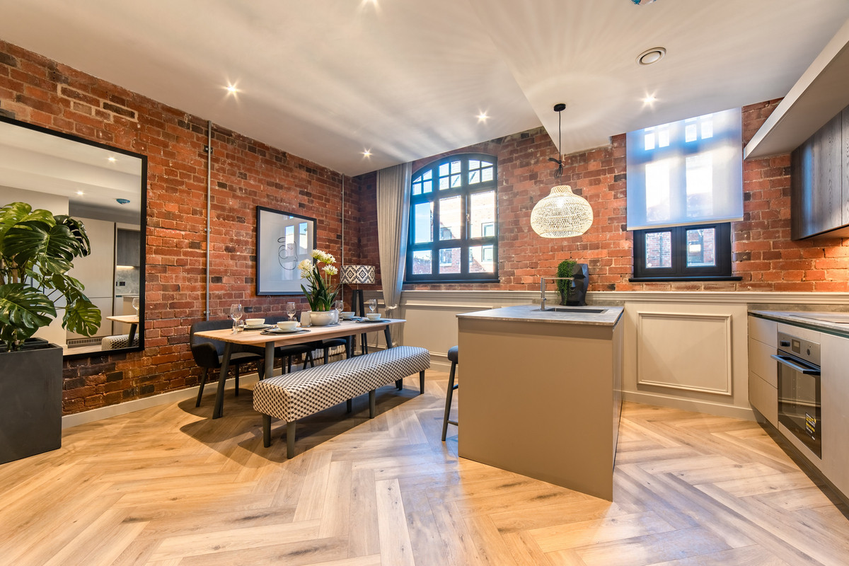 Stylish kitchen with exposed brick walls.