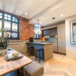 Modern kitchen with stylish dining area.