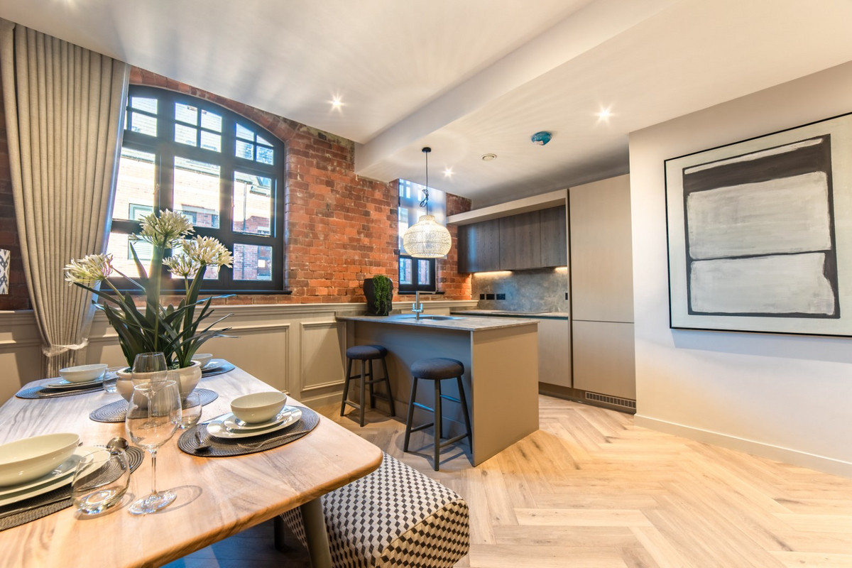 Modern kitchen with stylish dining area.