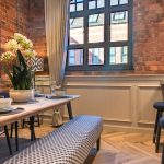 Stylish dining area with brick walls.