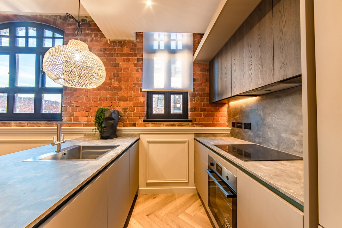 Modern kitchen with exposed brick wall