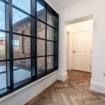 Modern interior with large windows.