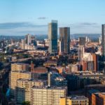 Vibrant city skyline under clear sky.