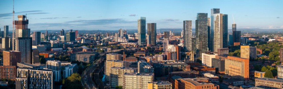 Vibrant city skyline under clear sky.