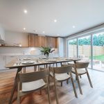 Modern kitchen with dining area.