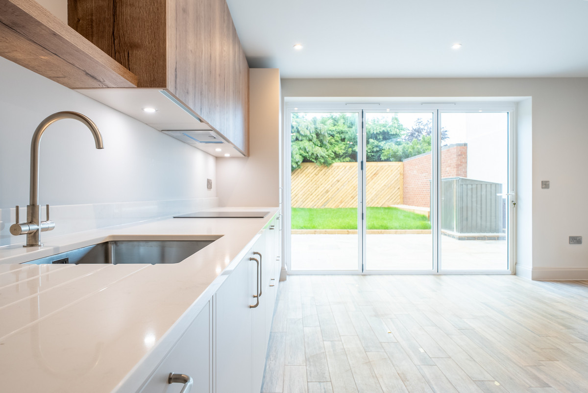 Modern kitchen with sliding glass doors.