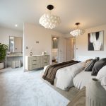 Spacious, modern bedroom with elegant decor.