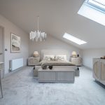 Modern, stylish bedroom with skylight.