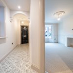 Modern hallway leading to spacious room