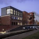 Modern building beside a canal.