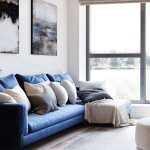 Modern living room with blue sofa