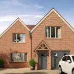 Modern brick house with driveway and garden