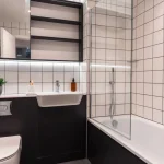 Modern bathroom with tiled walls.