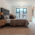 Modern bedroom with stylish furnishings.