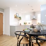 Modern kitchen with dining table.