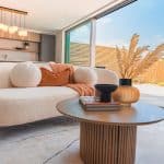 Lounge and large door baacking onto garden on a sunny day