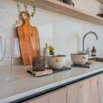Kitchen counter with wine glasses and chopping board