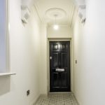 Modern hallway with black front door