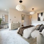 Spacious, modern bedroom with elegant decor.