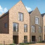 Modern brick houses with large windows.
