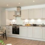 Modern kitchen with stylish grey cabinetry.
