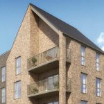Modern brick apartment building with balconies.