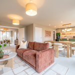 Modern living space with stylish furnishings connecting lounge area to kitchen diner at Avon Bard. A bespoke four-bedroom home in Stratford Upon Avon.