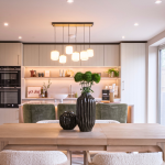 Modern kitchen with stylish dining area at Avon Bard. A bespoke four-bedroom home in Stratford Upon Avon.