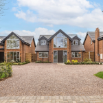 Modern, bespoke four-bedroom houses with large windows in Stratford Upon Avon with large driveway and landscaped gardens.
