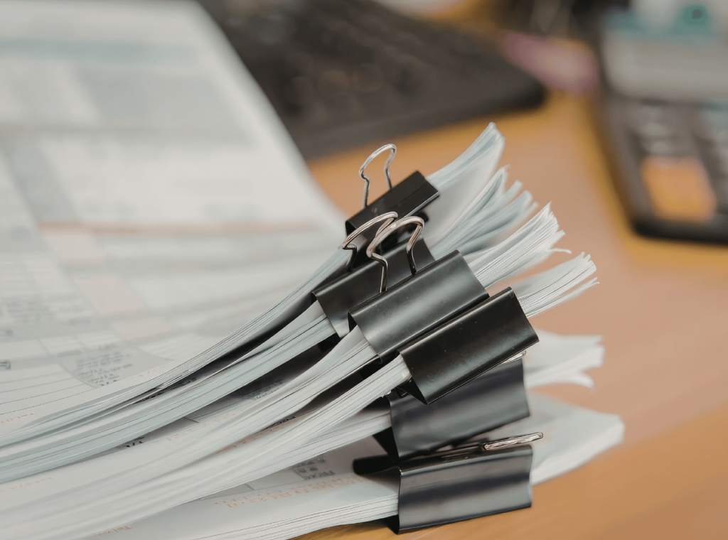 Stack of documents with binder clips